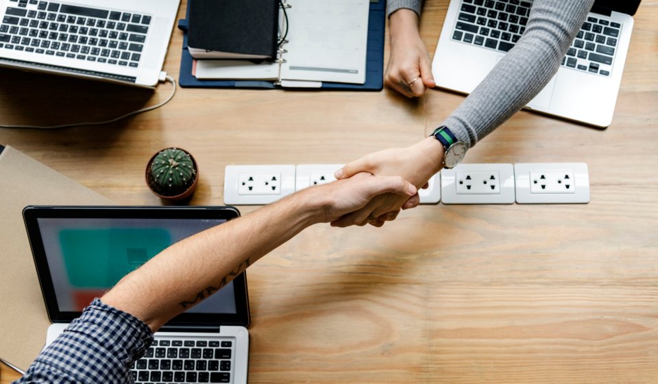 Business people shaking hands in agreement